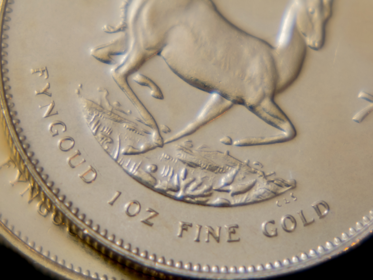 Image of a gold Krugerrand coin close up